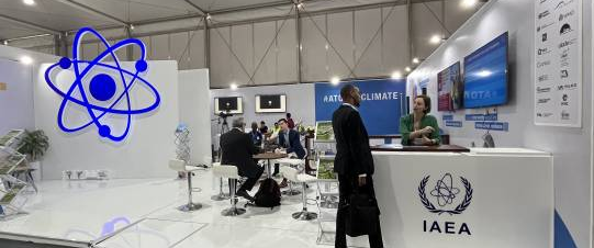 The IAEA stand at COP27 marked with its atom logo