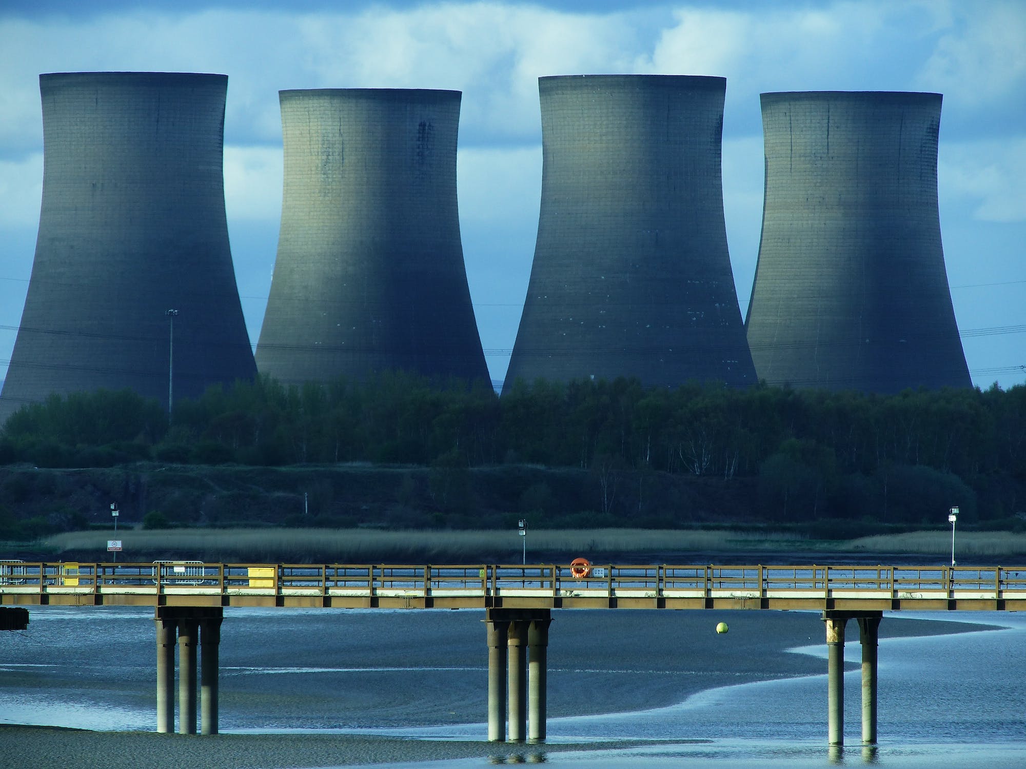 Cooling towers of a power station under a pale sky