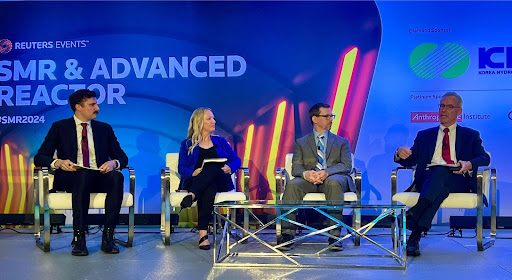Four panelists seated on stage in front of a Reuters SMR & Advanced Reactor backdrop