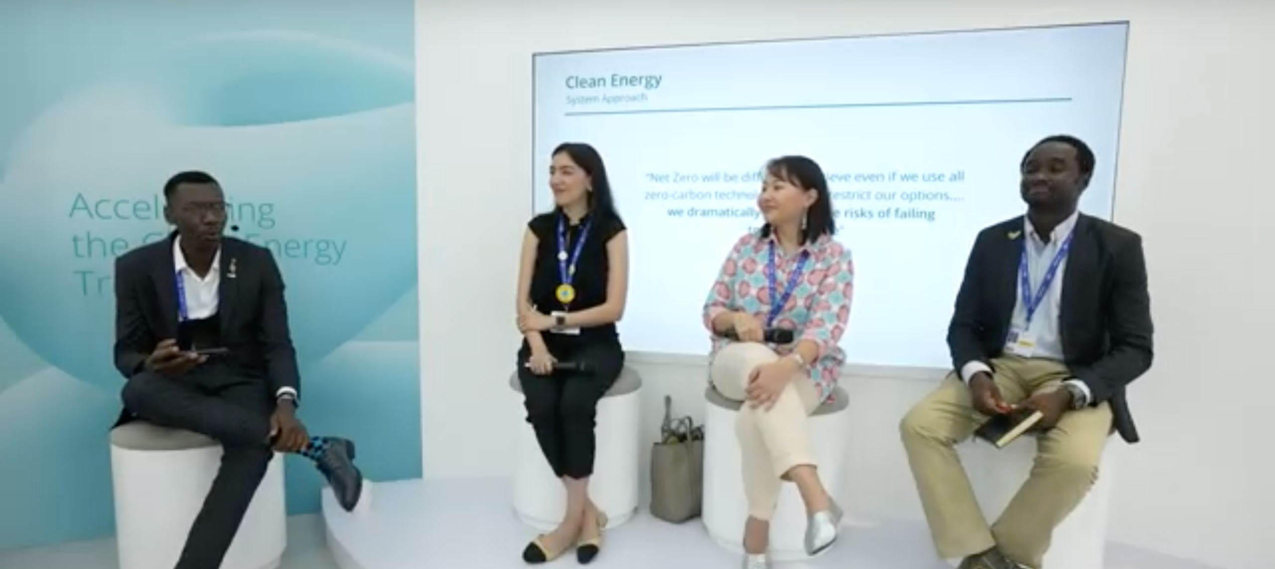 Four young engineers seated on stage during the Ask a Nuclear Engineer session