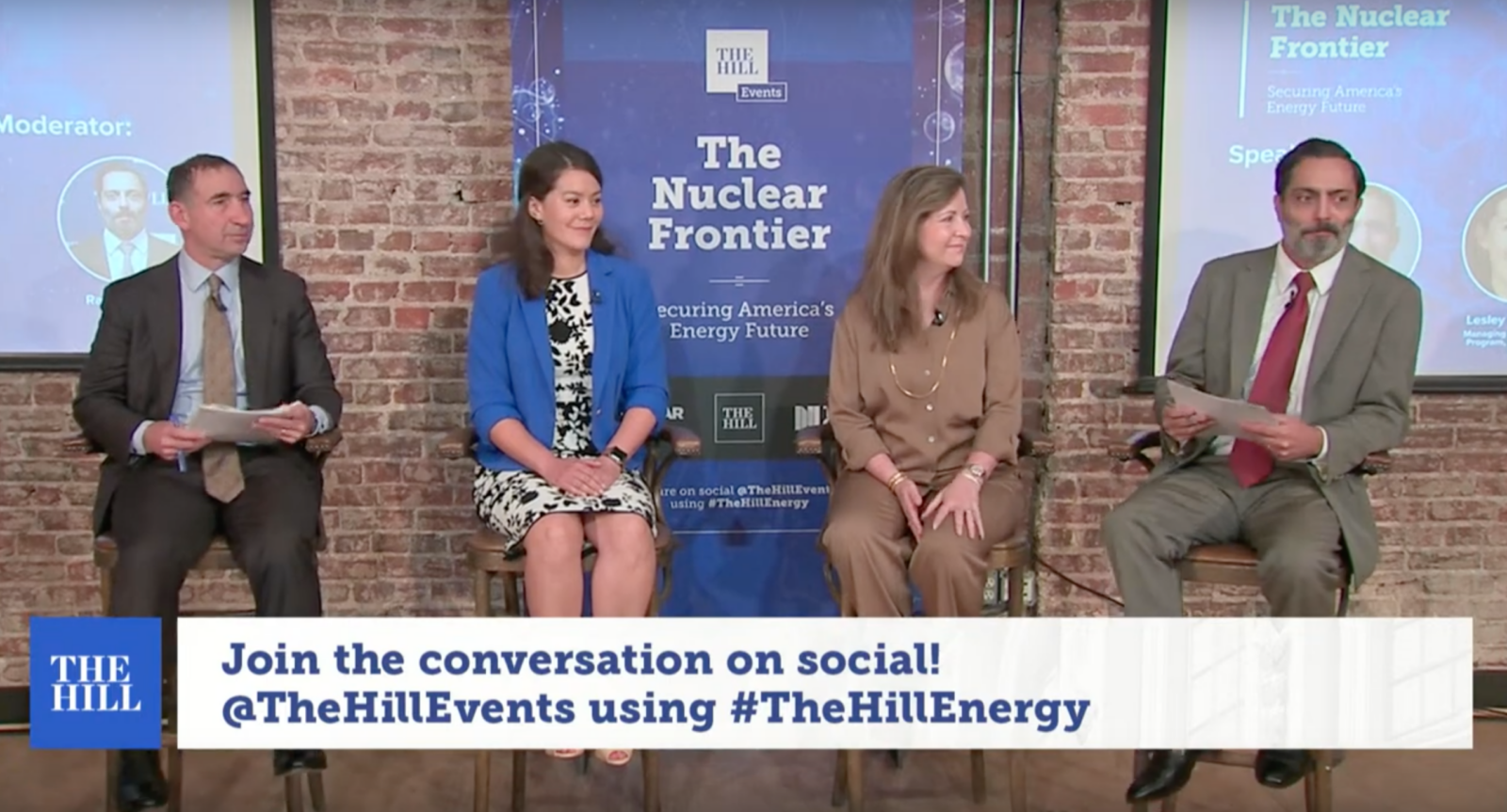 Three speakers seated on stage at The Hill’s Nuclear Frontier event, with an on-screen banner inviting viewers to join the conversation